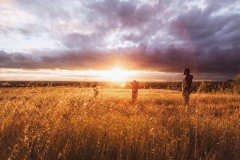 Group enjoys quite, beautiful, late afternoon meadow.